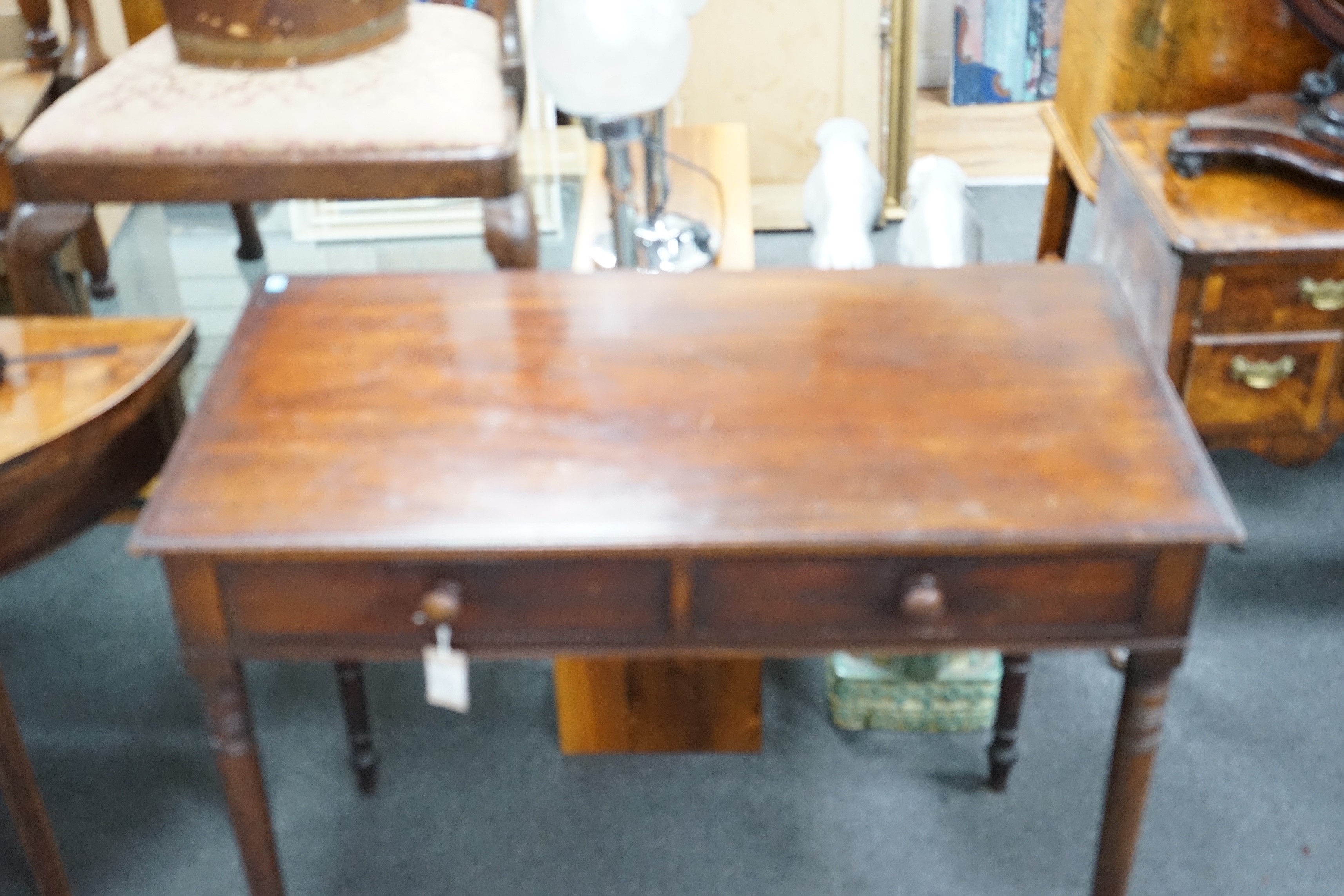 A Regency mahogany two drawer side table with moulded edge on turned legs, width 95cm, depth 51cm, height 78cm